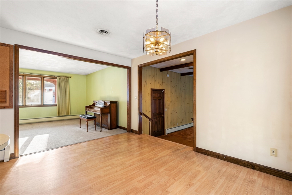 26 Nottingham Drive Raynham, MA 02767 - Photo 15 of 42 a view of a room with a chandelier entryway and wooden floor