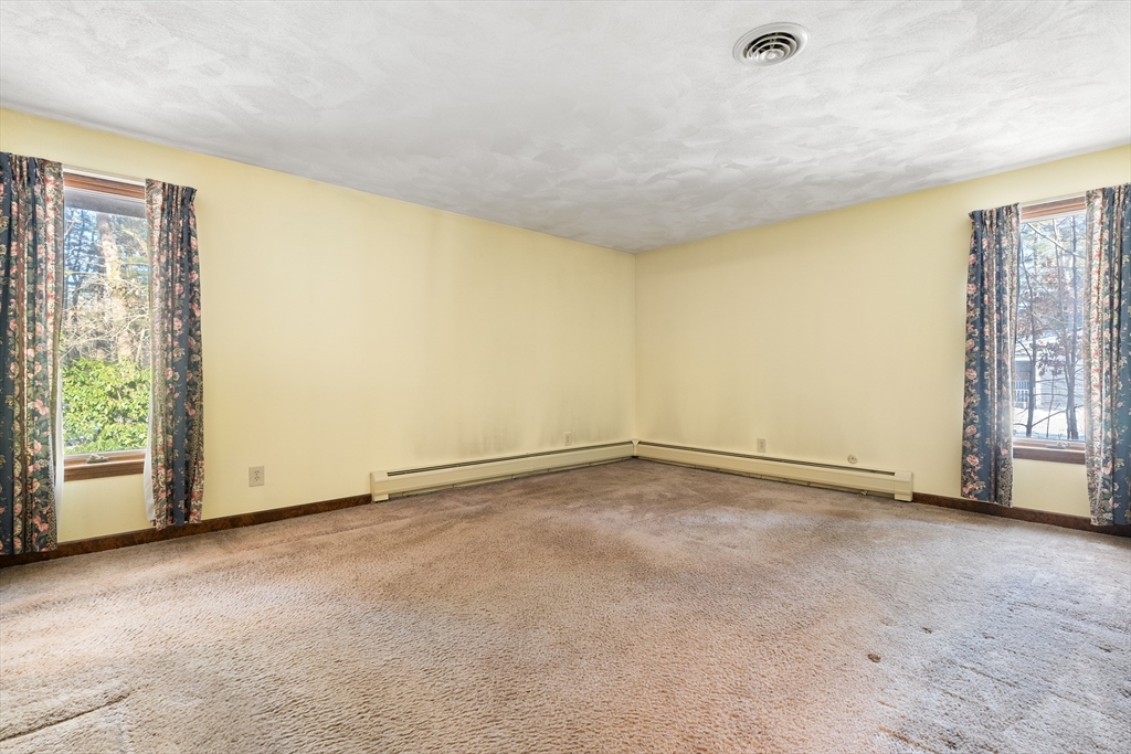 26 Nottingham Drive Raynham, MA 02767 - Photo 22 of 42 a view of an empty room with a window
