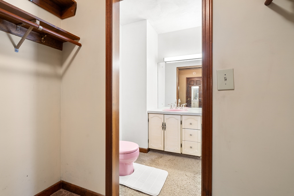 26 Nottingham Drive Raynham, MA 02767 - Photo 24 of 42 a bathroom with a sink a toilet and mirror