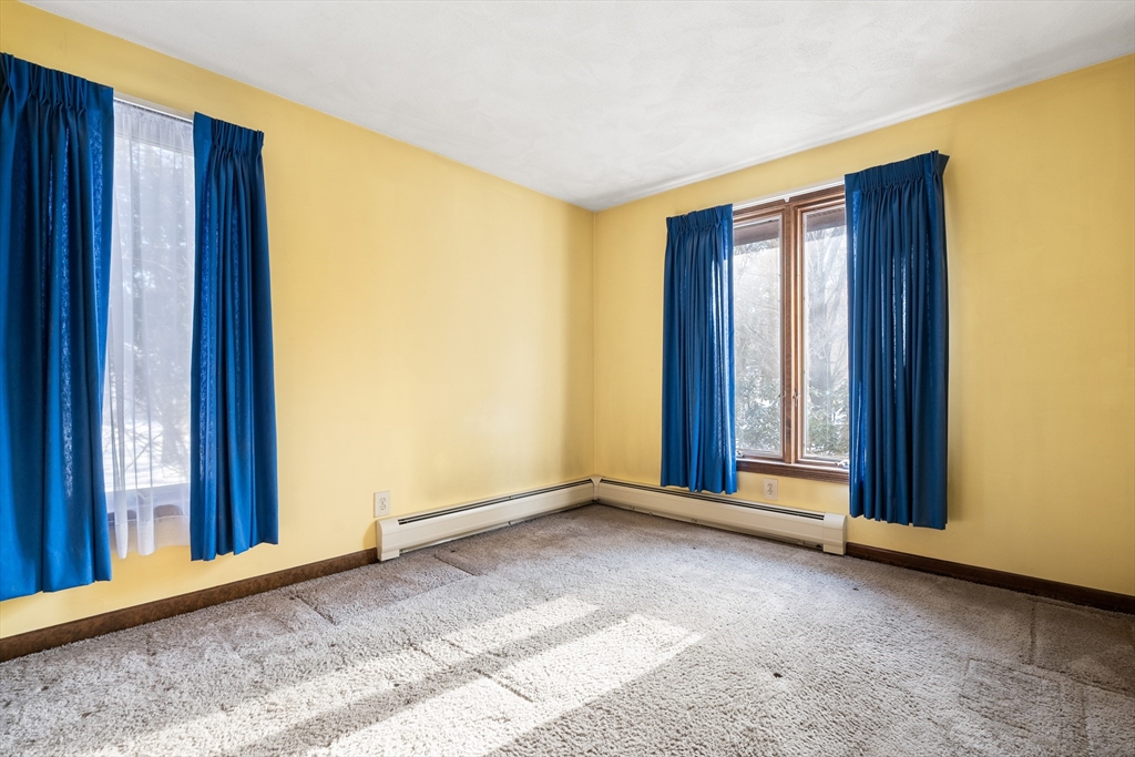 26 Nottingham Drive Raynham, MA 02767 - Photo 27 of 42 a view of an empty room with window