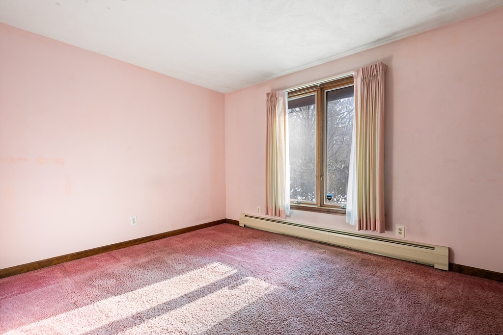 26 Nottingham Drive Raynham, MA 02767 - Photo 29 of 42 a view of an empty room with a window