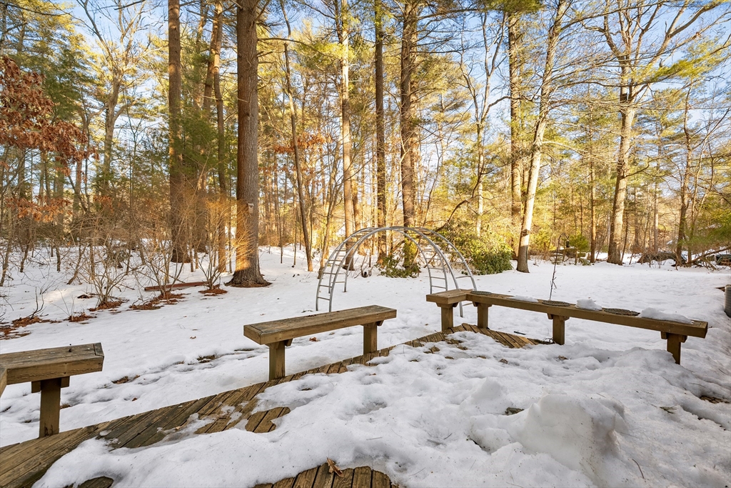 26 Nottingham Drive Raynham, MA 02767 - Photo 37 of 42 a bench sitting in middle of a house