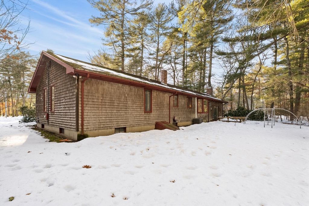 26 Nottingham Drive Raynham, MA 02767 - Photo 41 of 42 a view of a house covered in snow
