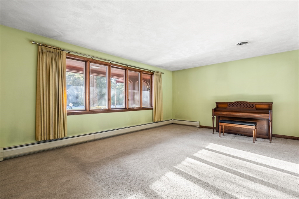 26 Nottingham Drive Raynham, MA 02767 - Photo 5 of 42 a view of a room with large windows