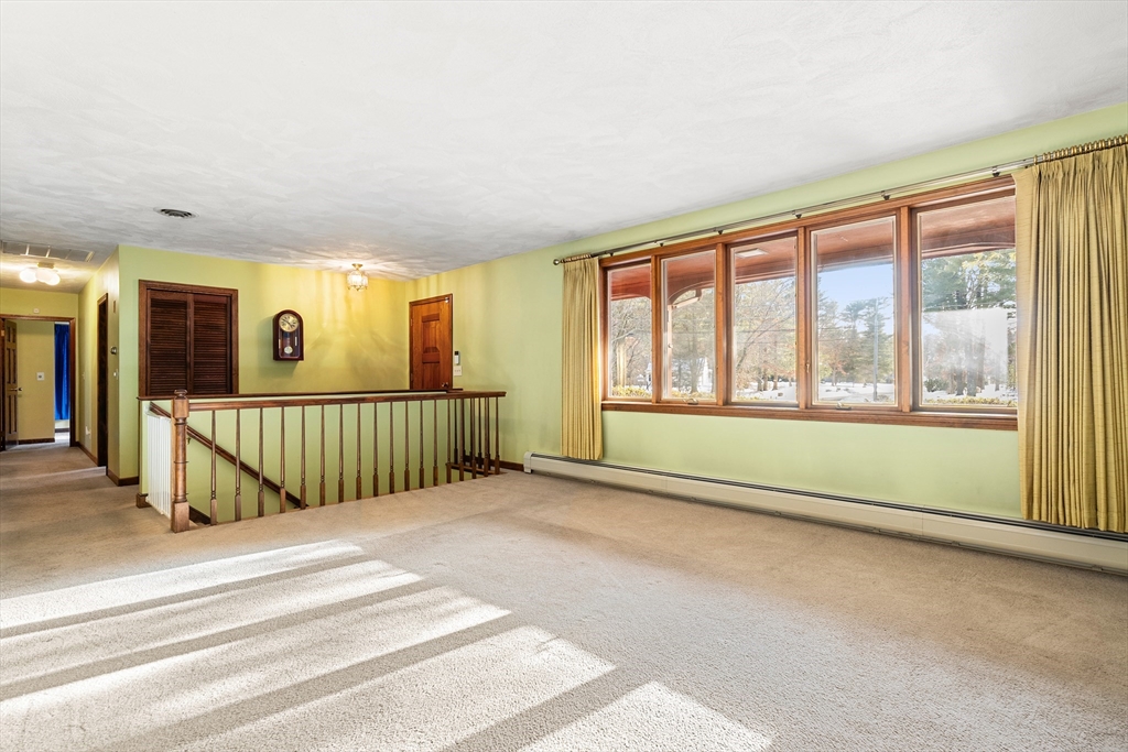 26 Nottingham Drive Raynham, MA 02767 - Photo 6 of 42 a view of an entryway with a floor to ceiling window and a living room