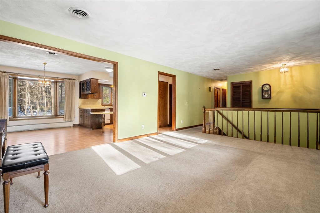 26 Nottingham Drive Raynham, MA 02767 - Photo 7 of 42 a view of a bedroom with a bed and wooden floor