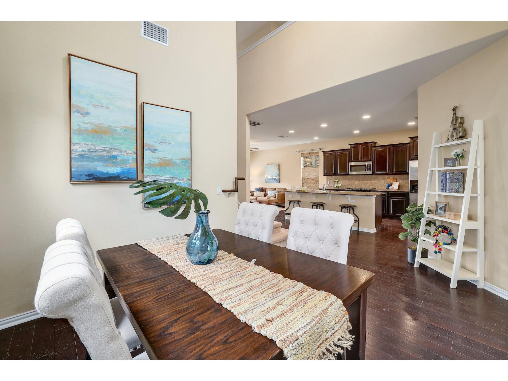 16021 Travesia Way Austin, TX 78728 - Photo 1 of 27 a living room with furniture and a wooden floor