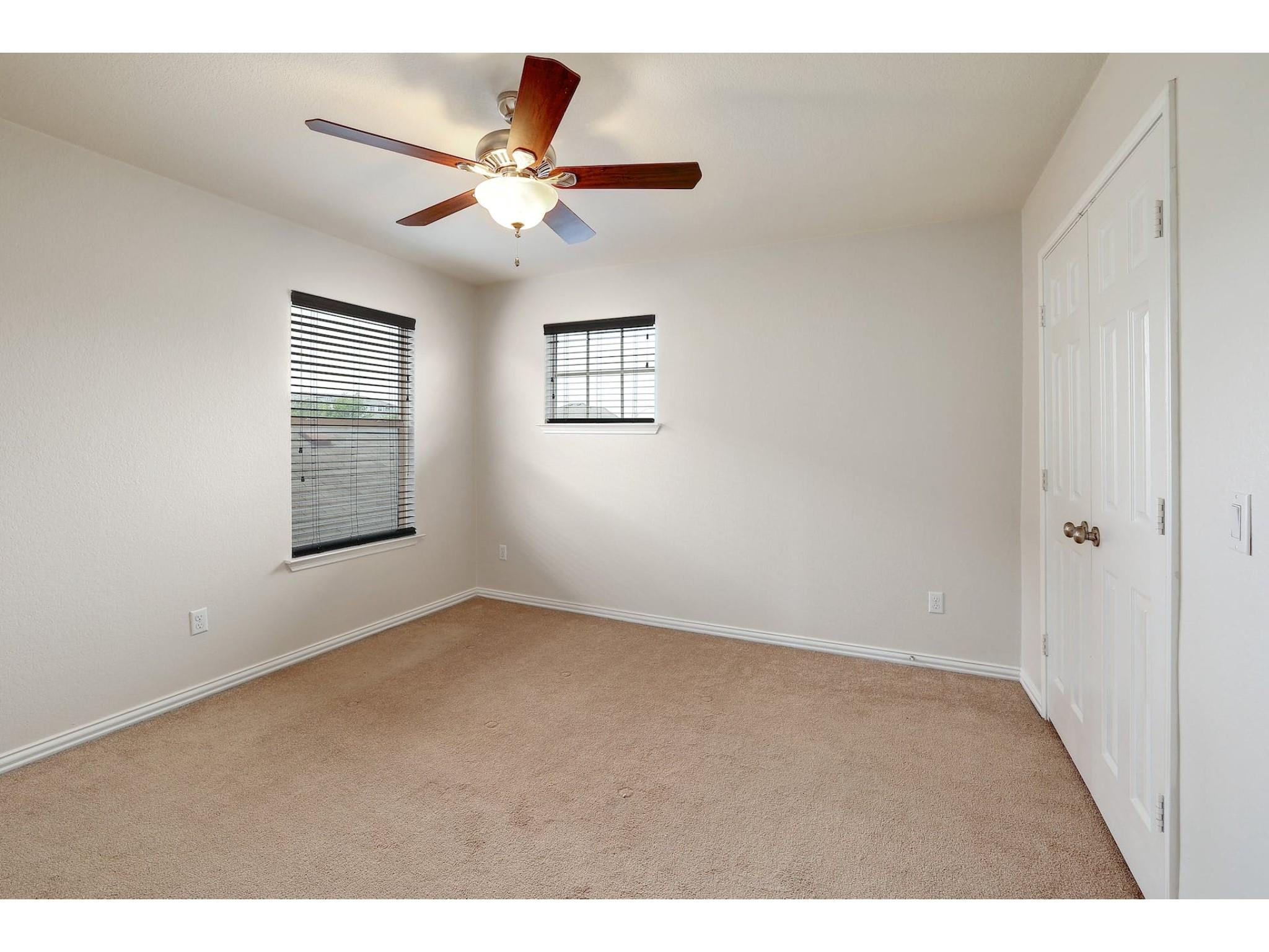 16021 Travesia Way Austin, TX 78728 - Photo 18 of 27 a view of an empty room with a window