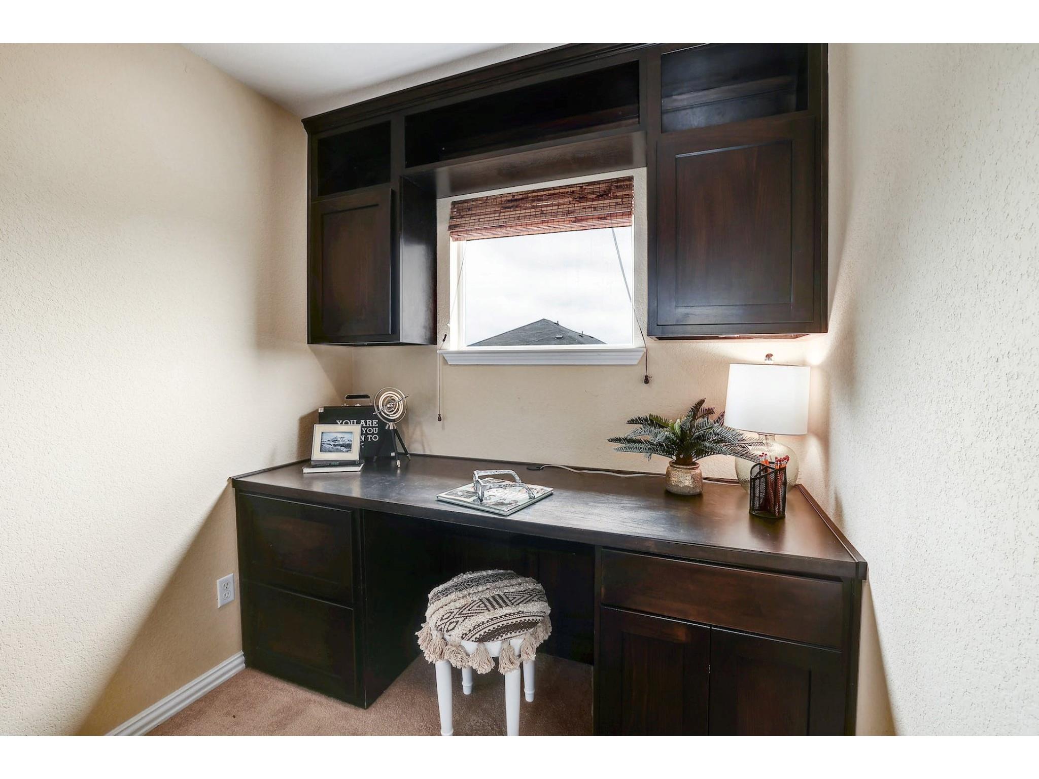 16021 Travesia Way Austin, TX 78728 - Photo 20 of 27 a kitchen with a sink and a cabinets