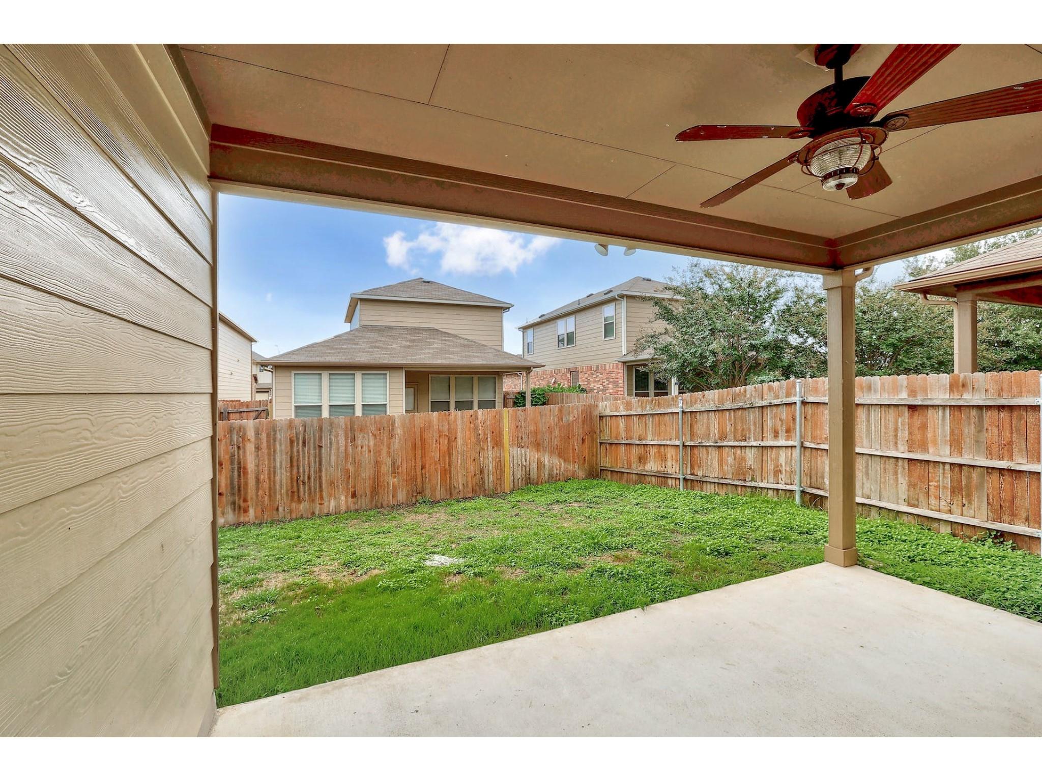 16021 Travesia Way Austin, TX 78728 - Photo 25 of 27 a view of a backyard with wooden fence