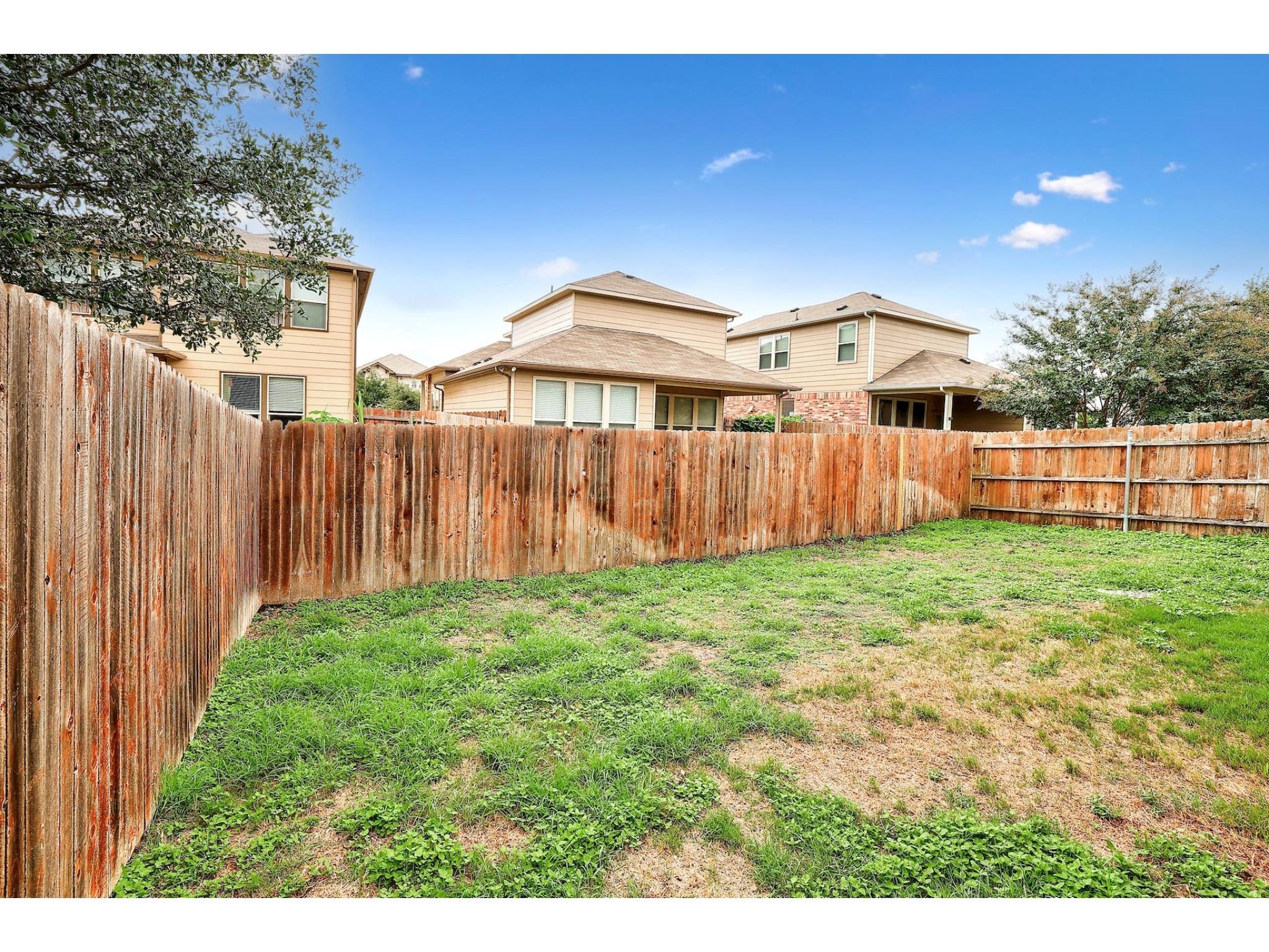 16021 Travesia Way Austin, TX 78728 - Photo 27 of 27 a view of a backyard with a garden