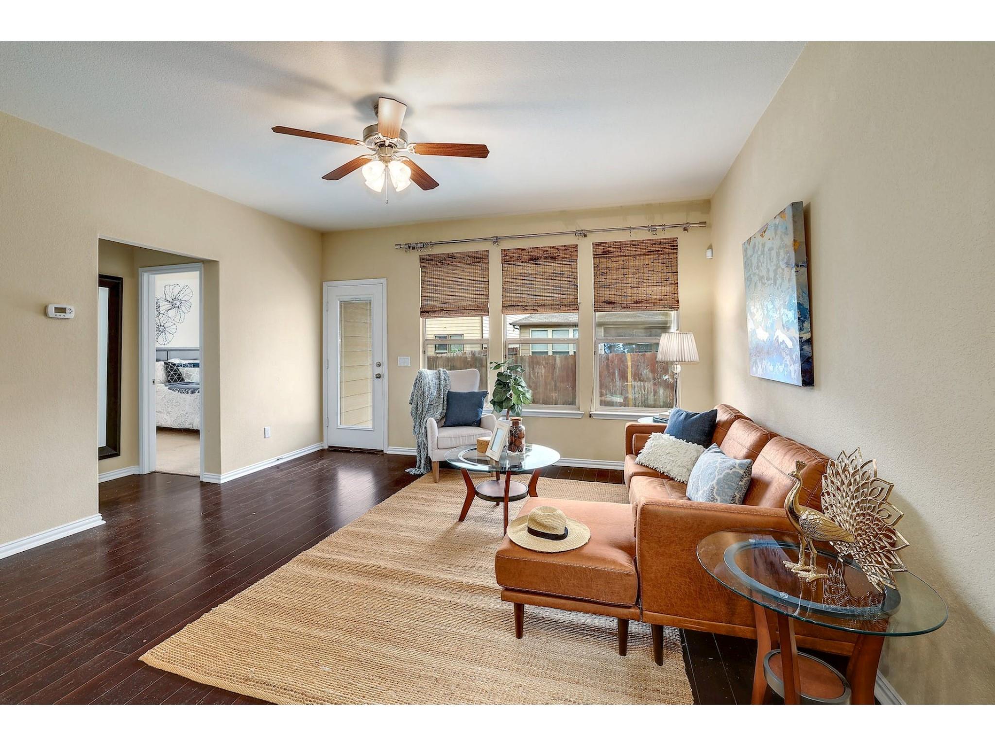 16021 Travesia Way Austin, TX 78728 - Photo 10 of 27 a living room with furniture and a large window