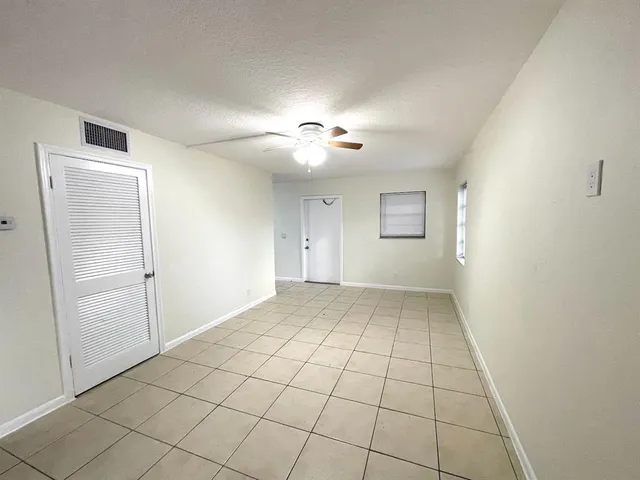 a view of empty room with windows