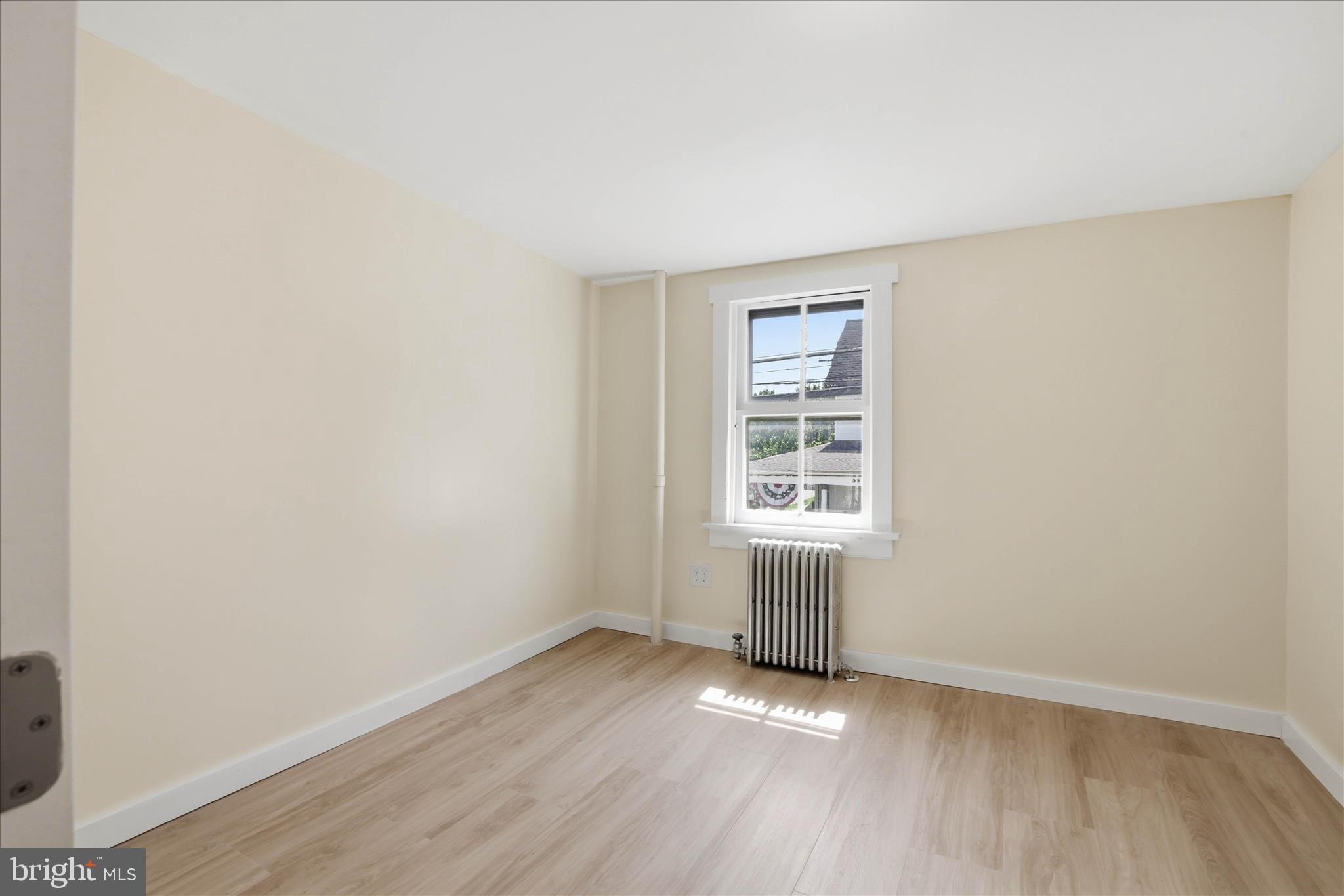 101 East Lincoln Avenue Lititz, PA 17543 - Photo 31 of 39 an empty room with wooden floor and windows