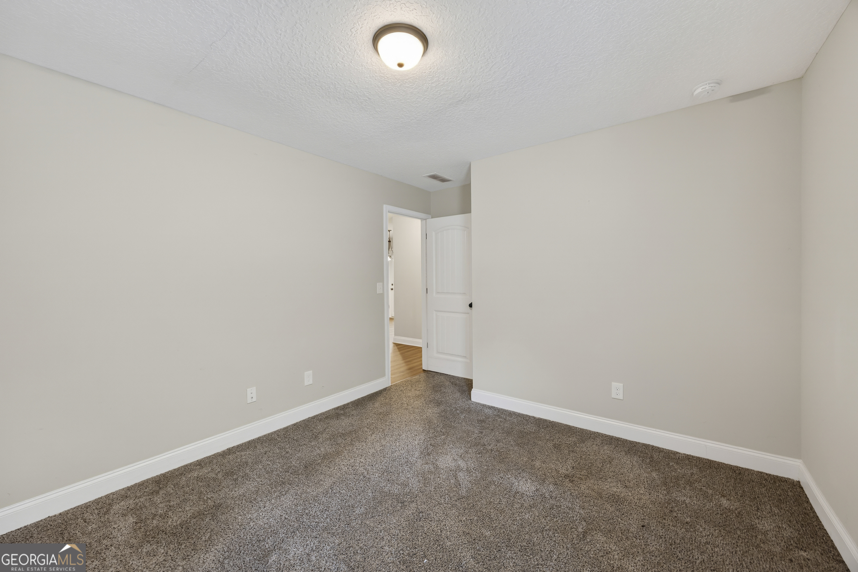 717 Oconee Lane Commerce, GA 30529 - Photo 36 of 57 an empty room with an entryway