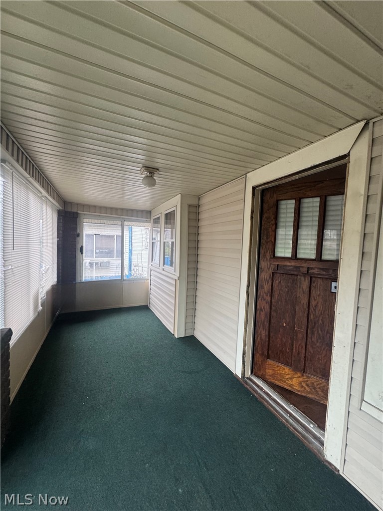 577 Rhodes Avenue Akron, OH 44307 - Photo 3 of 19 View of unfurnished sunroom