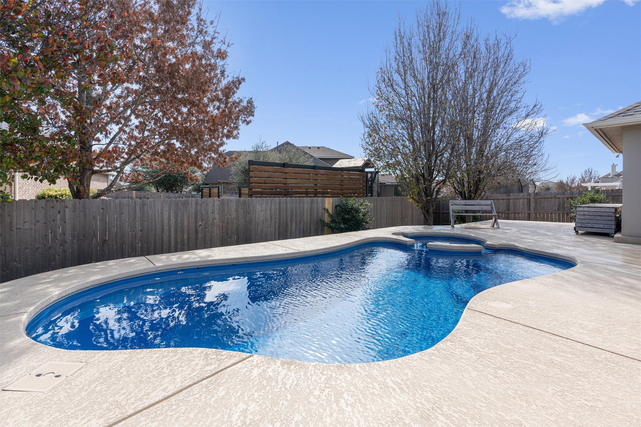 20513 Jackies Ranch Boulevard Pflugerville, TX 78660 - Photo 1 of 35 a view of a swimming pool with a patio