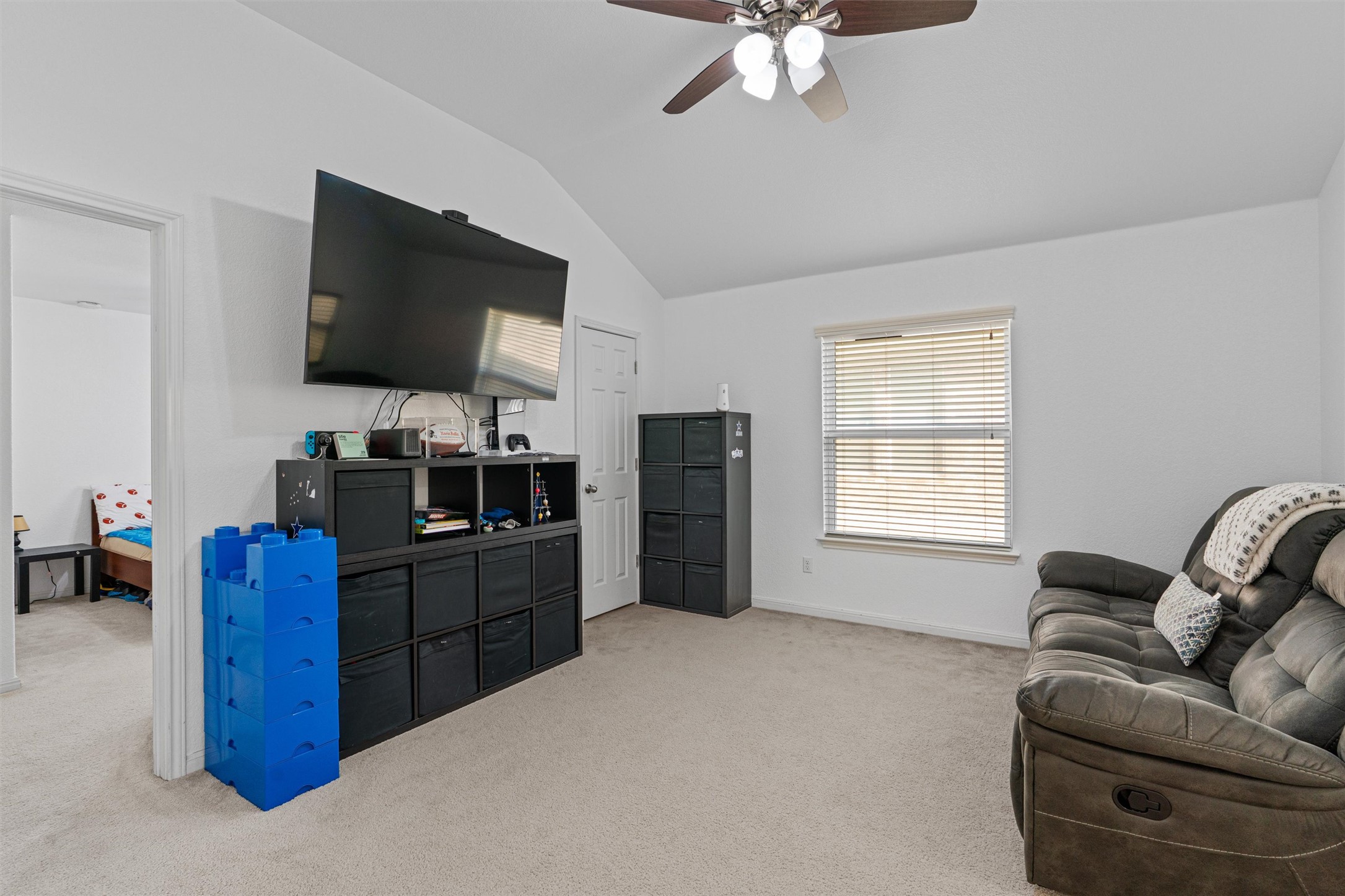 20513 Jackies Ranch Boulevard Pflugerville, TX 78660 - Photo 15 of 35 a living room with furniture and a flat screen tv