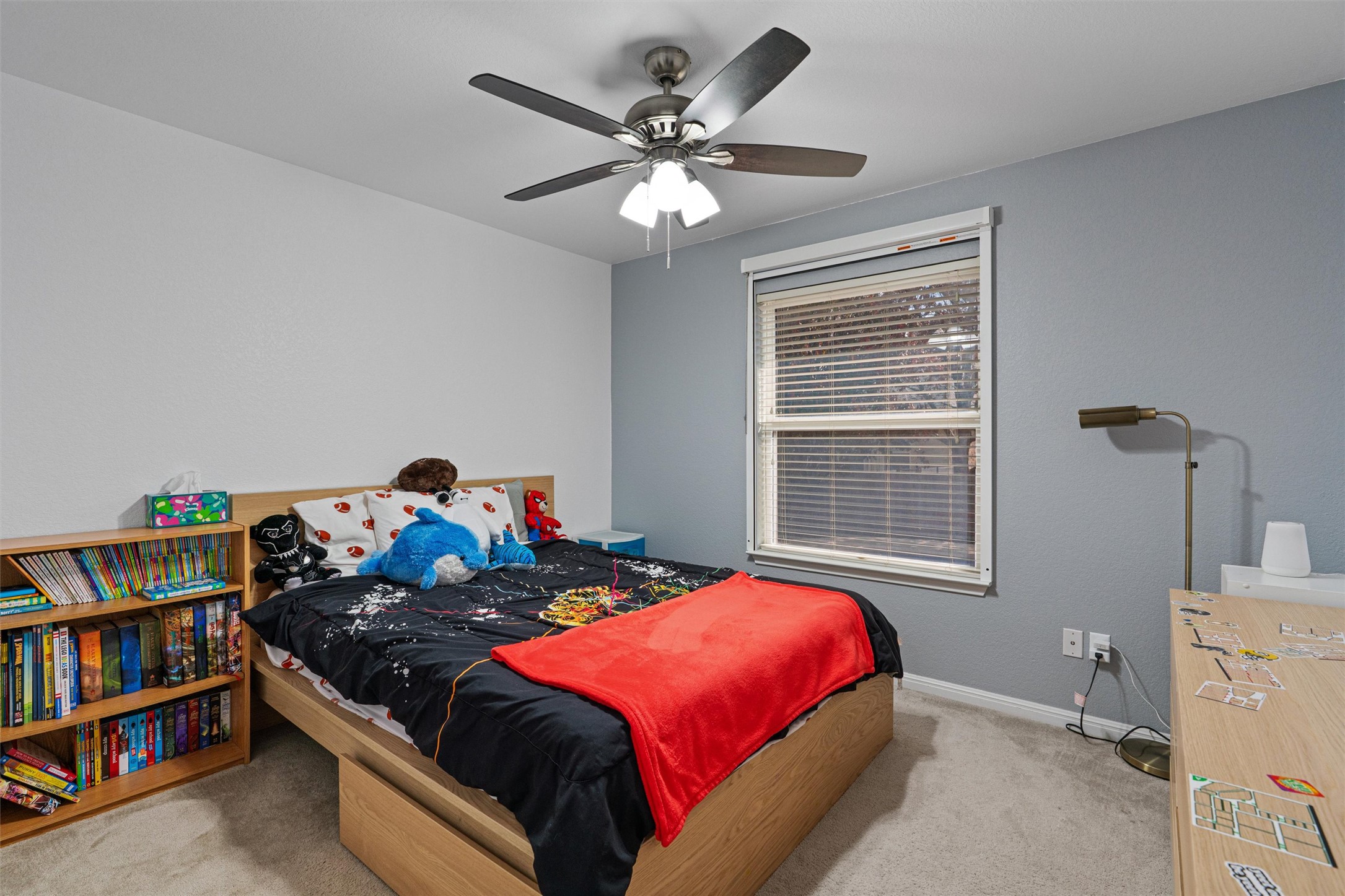 20513 Jackies Ranch Boulevard Pflugerville, TX 78660 - Photo 19 of 35 a bedroom with a bed and a book shelf