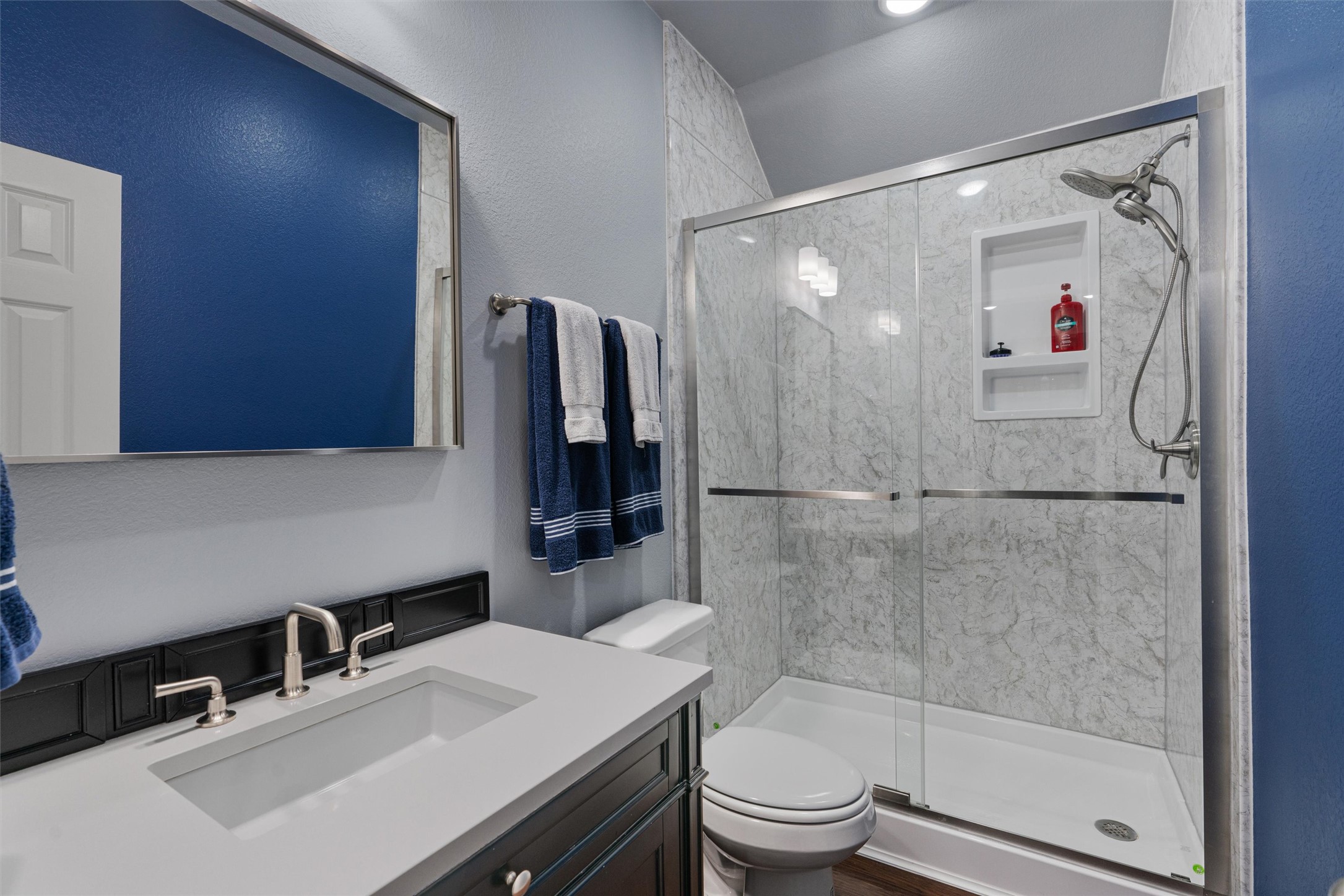 20513 Jackies Ranch Boulevard Pflugerville, TX 78660 - Photo 20 of 35 a bathroom with a sink a toilet and shower