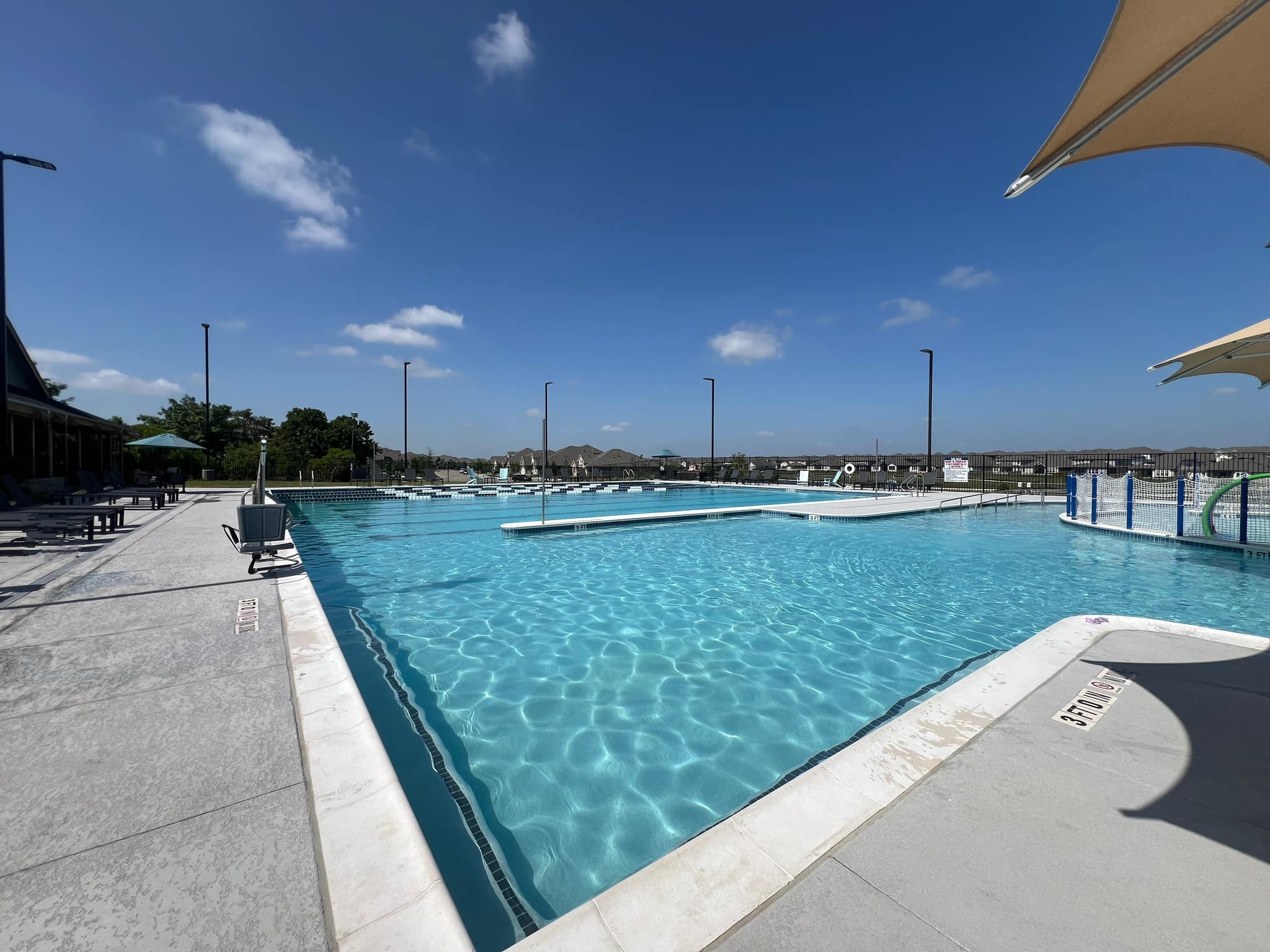 20513 Jackies Ranch Boulevard Pflugerville, TX 78660 - Photo 30 of 35 a view of a swimming pool with a yard
