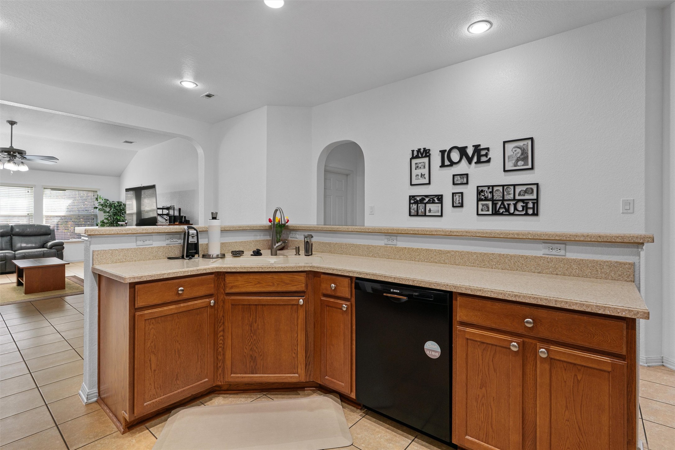 20513 Jackies Ranch Boulevard Pflugerville, TX 78660 - Photo 3 of 35 a kitchen with a sink and cabinets