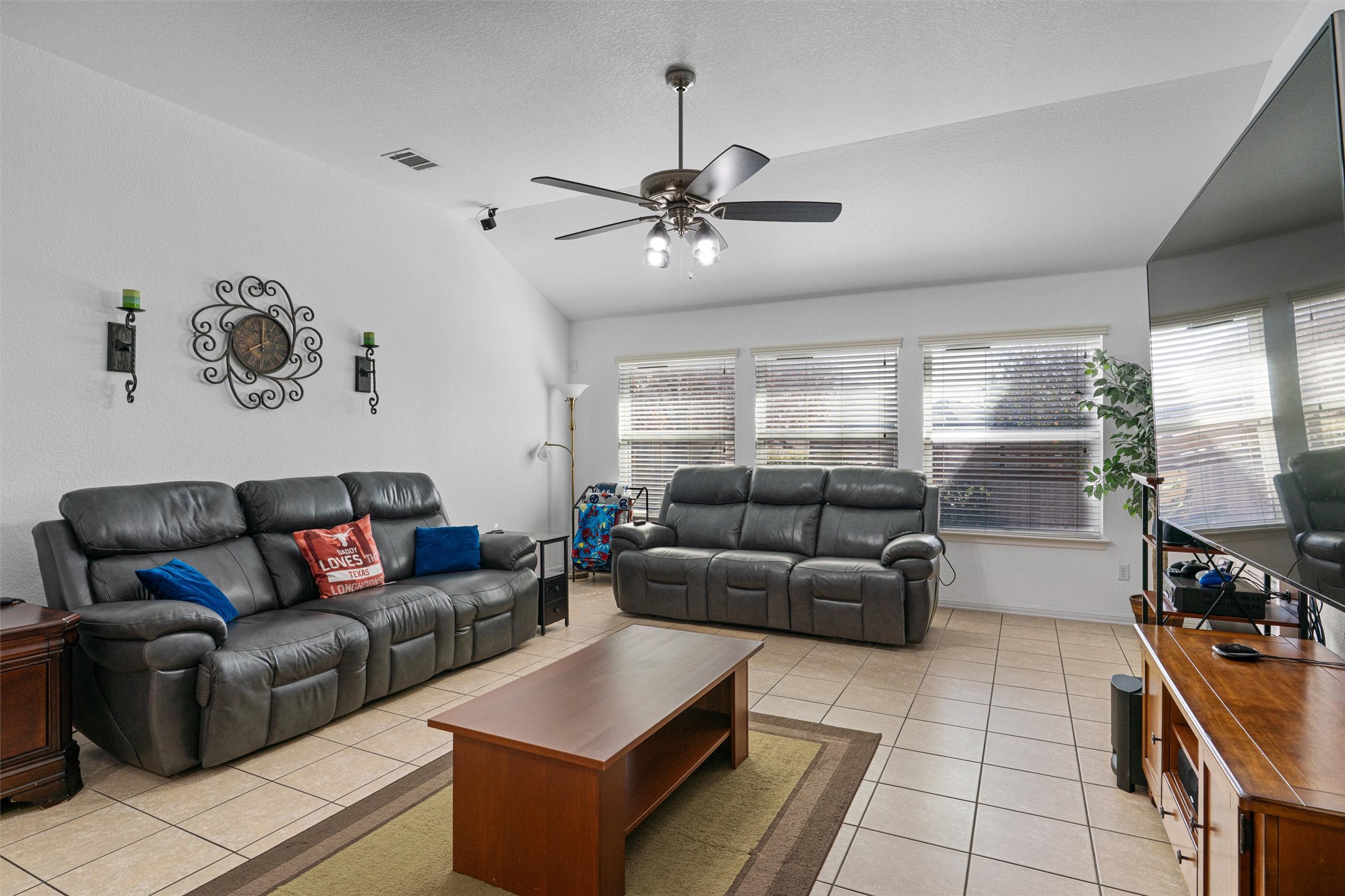 20513 Jackies Ranch Boulevard Pflugerville, TX 78660 - Photo 5 of 35 a living room with furniture and a chandelier