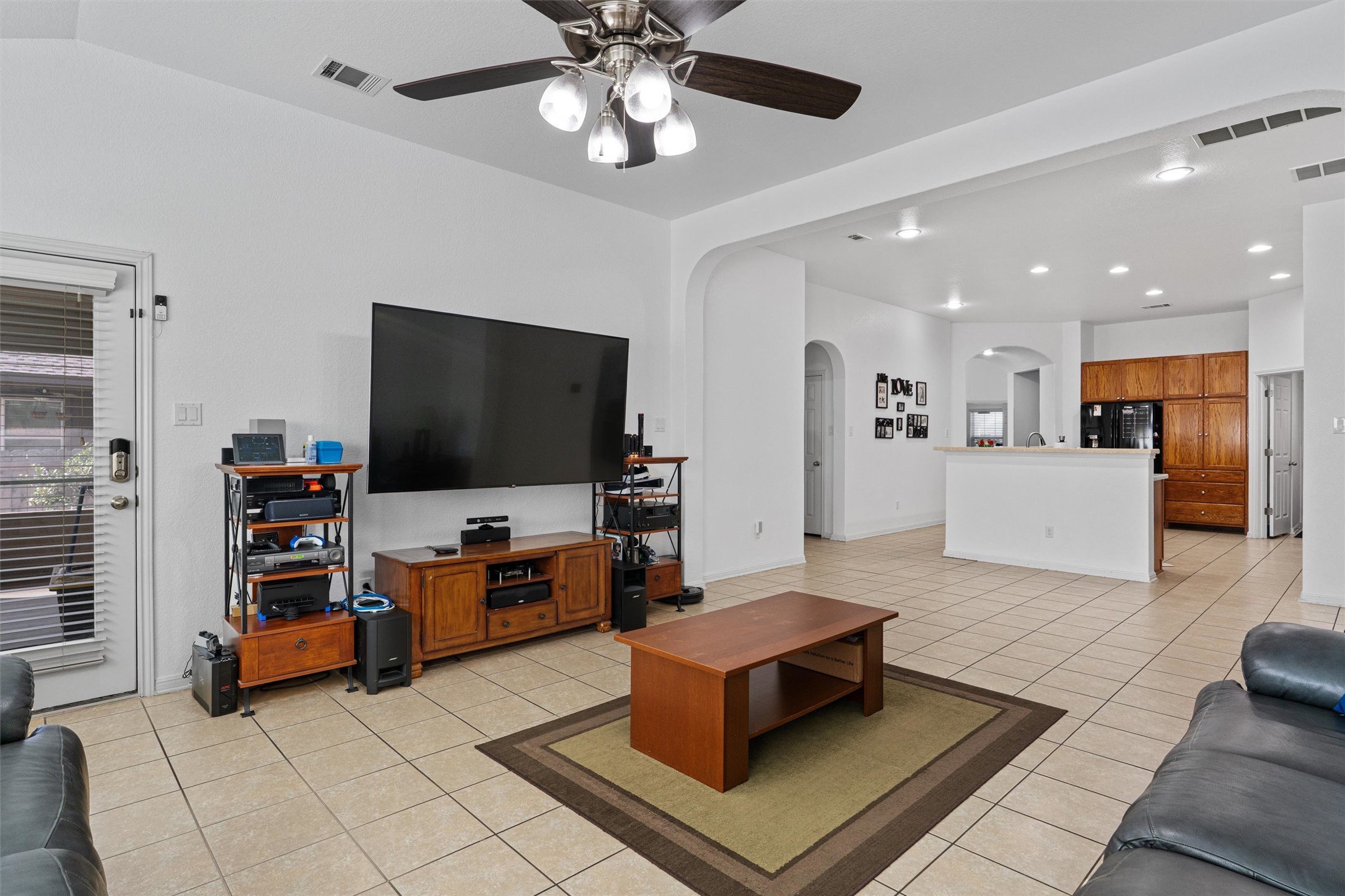 20513 Jackies Ranch Boulevard Pflugerville, TX 78660 - Photo 6 of 35 a living room with furniture and a flat screen tv