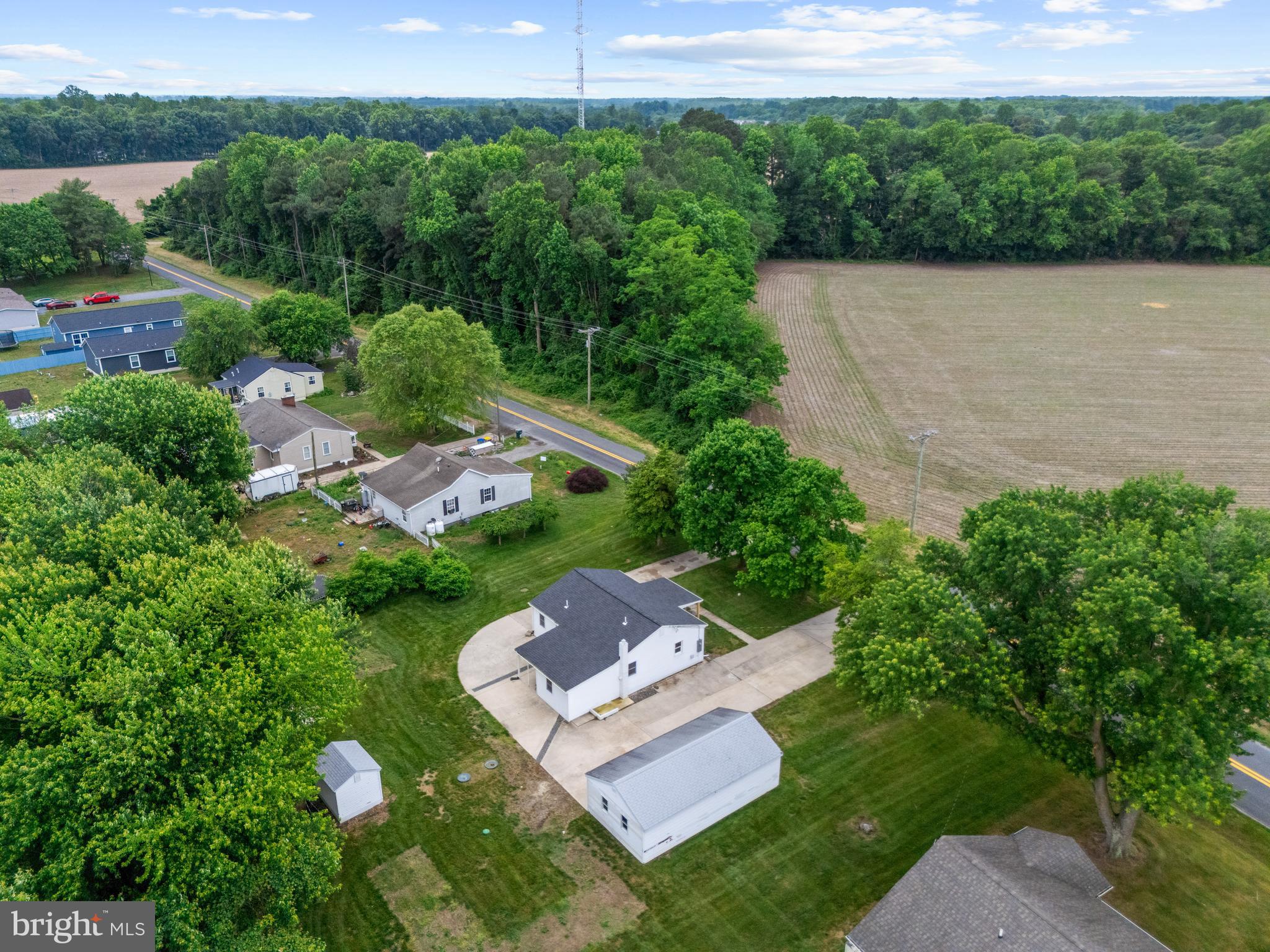 6475 Big Stone Beach Road Milford, DE 19963 - Photo 50 of 52 an aerial view of a house with a yard and lake view