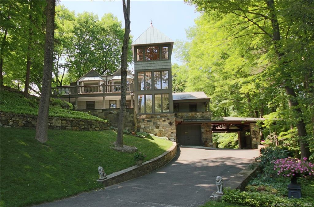 329 Limestone Road Ridgefield, CT 06877 - Photo 1 of 1 a view of a wooden house with a yard and large trees