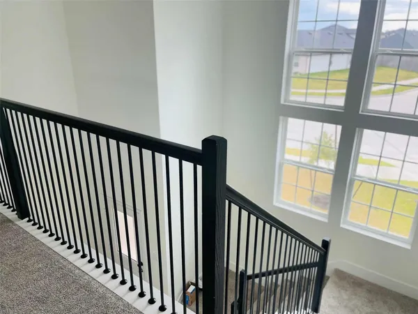 a view of a staircase from a balcony