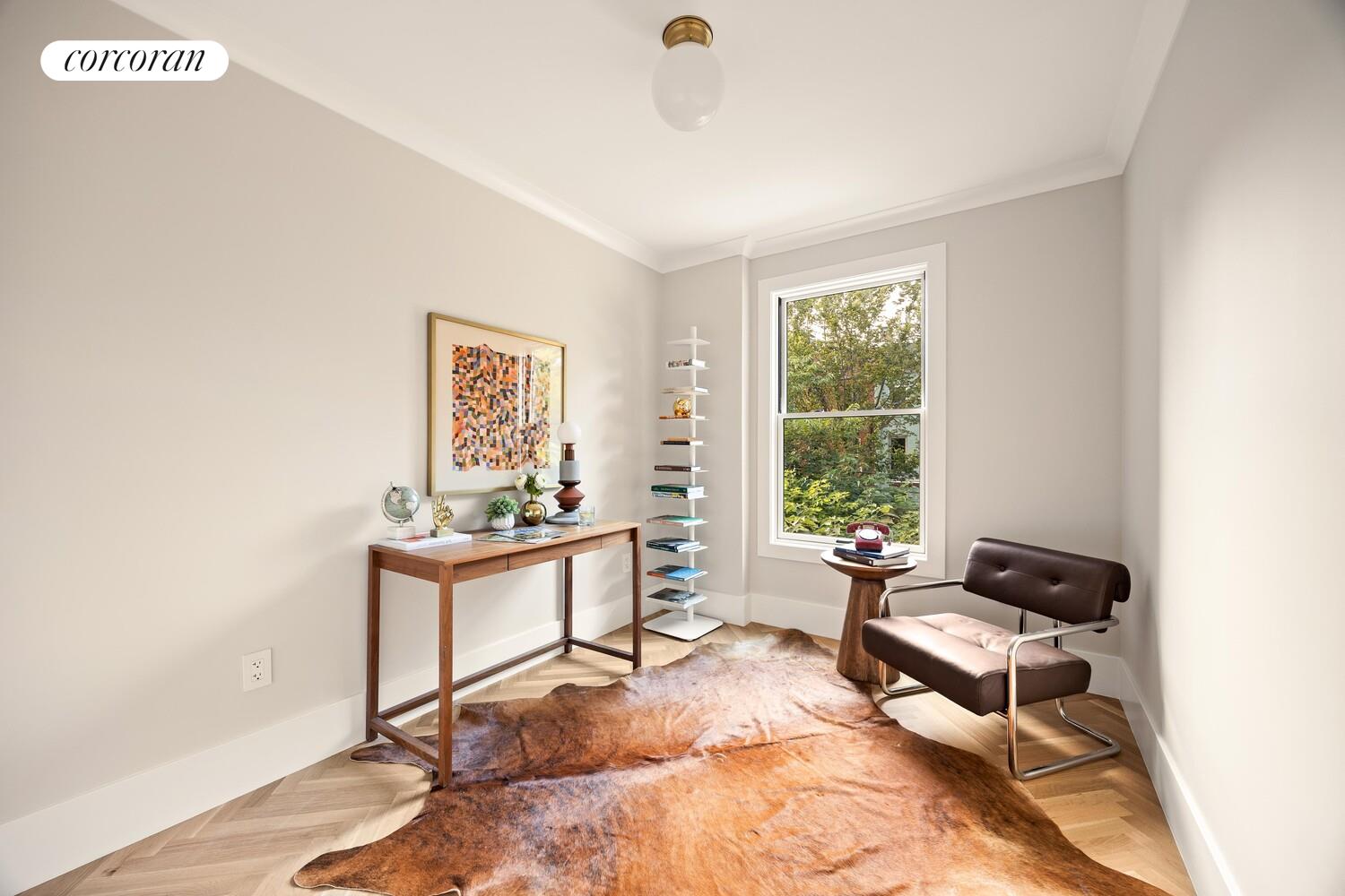 95 Monroe Street Brooklyn, NY 11216 - Photo 13 of 21 a living room with furniture and a window