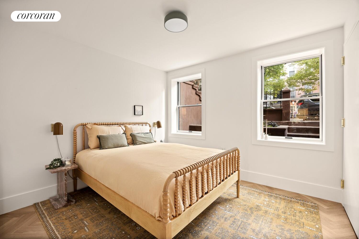 95 Monroe Street Brooklyn, NY 11216 - Photo 16 of 21 a bedroom with a bed and a window