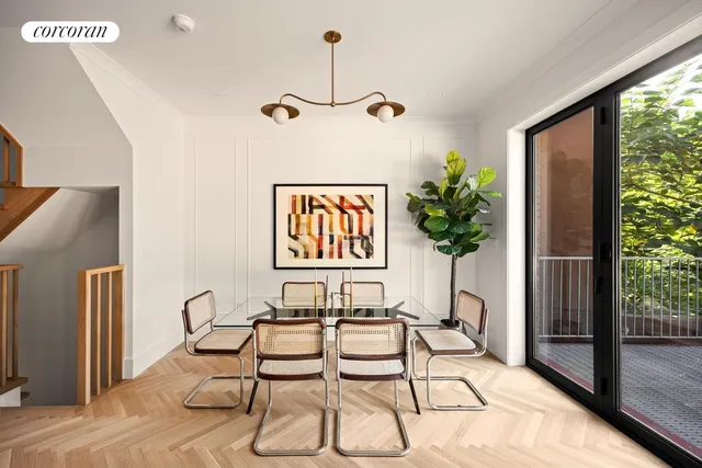 a view of a living room and a floor to ceiling window