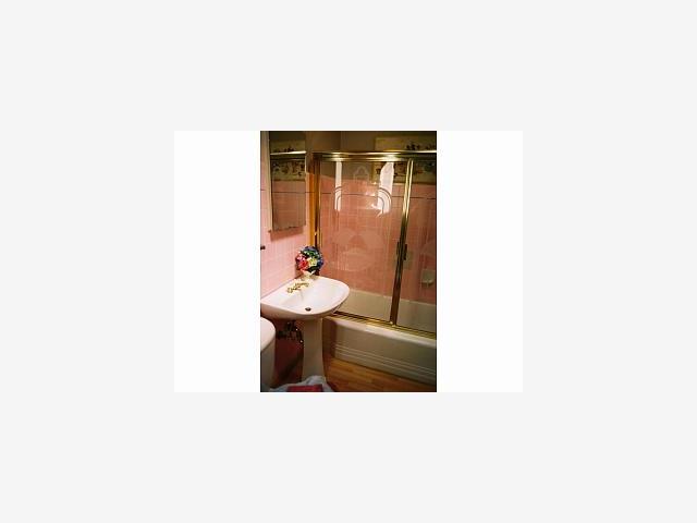 228 Bancroft Road Burlingame, CA 94010 - Photo 8 of 9 a bathroom with a sink and mirror