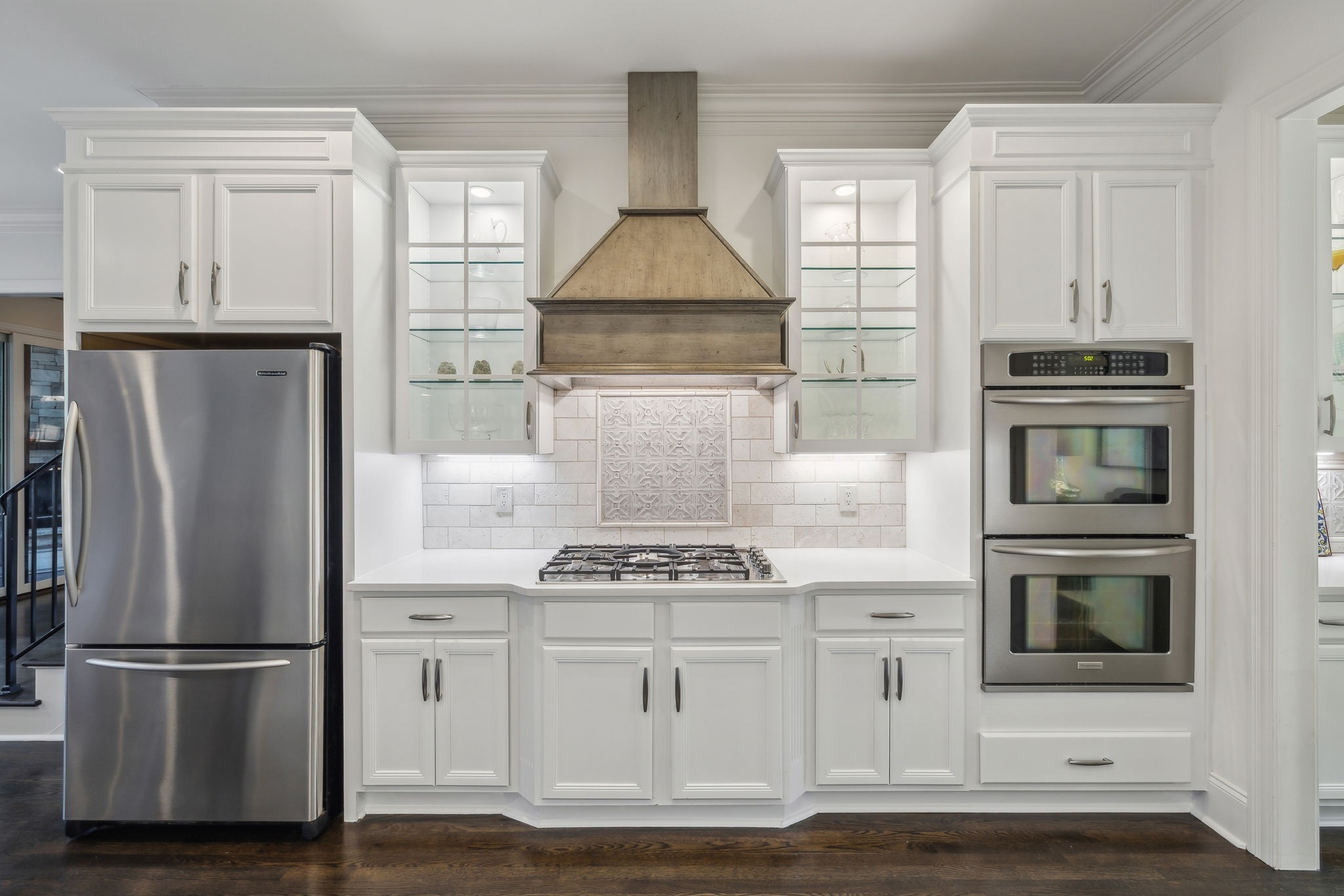 424 Wild Elm Street Franklin, TN 37064 - Photo 17 of 100 a kitchen with white cabinets and stainless steel appliances