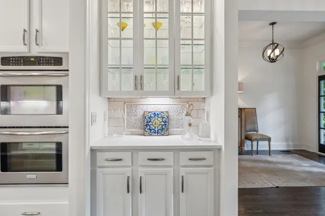 a spacious bathroom with a shower sink and a mirror