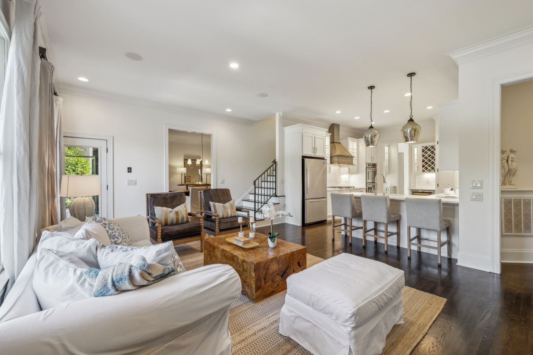 424 Wild Elm Street Franklin, TN 37064 - Photo 19 of 100 a living room with furniture kitchen view and a wooden floor