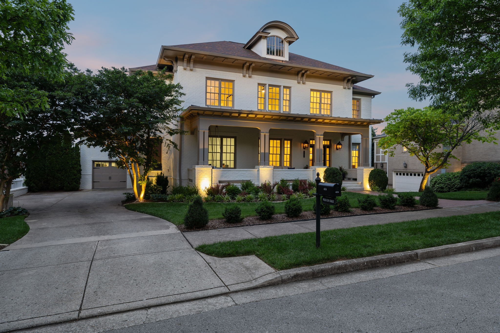 424 Wild Elm Street Franklin, TN 37064 - Photo 2 of 100 a front view of a house with a garden and trees