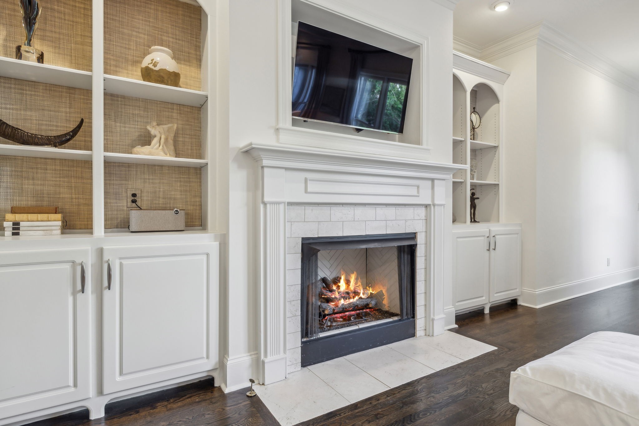 424 Wild Elm Street Franklin, TN 37064 - Photo 24 of 100 a living room with a fireplace and a flat screen tv