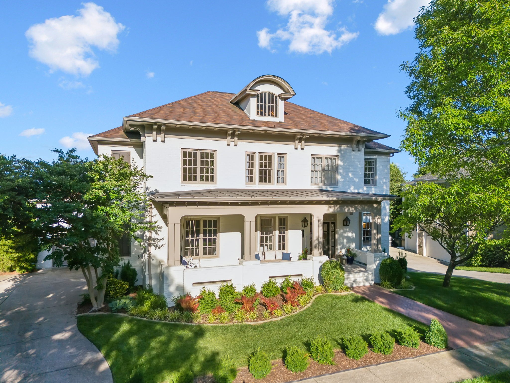 424 Wild Elm Street Franklin, TN 37064 - Photo 3 of 100 a front view of a house with a garden