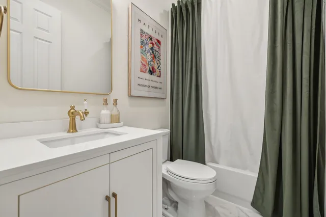 a kitchen with stainless steel appliances granite countertop a sink and a stove