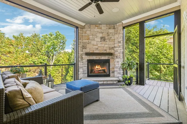 a kitchen with stainless steel appliances granite countertop sink stove and wooden floor