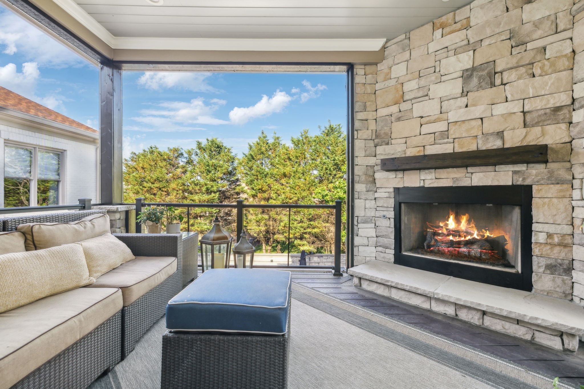 424 Wild Elm Street Franklin, TN 37064 - Photo 34 of 100 a living room with a fireplace and a floor to ceiling window