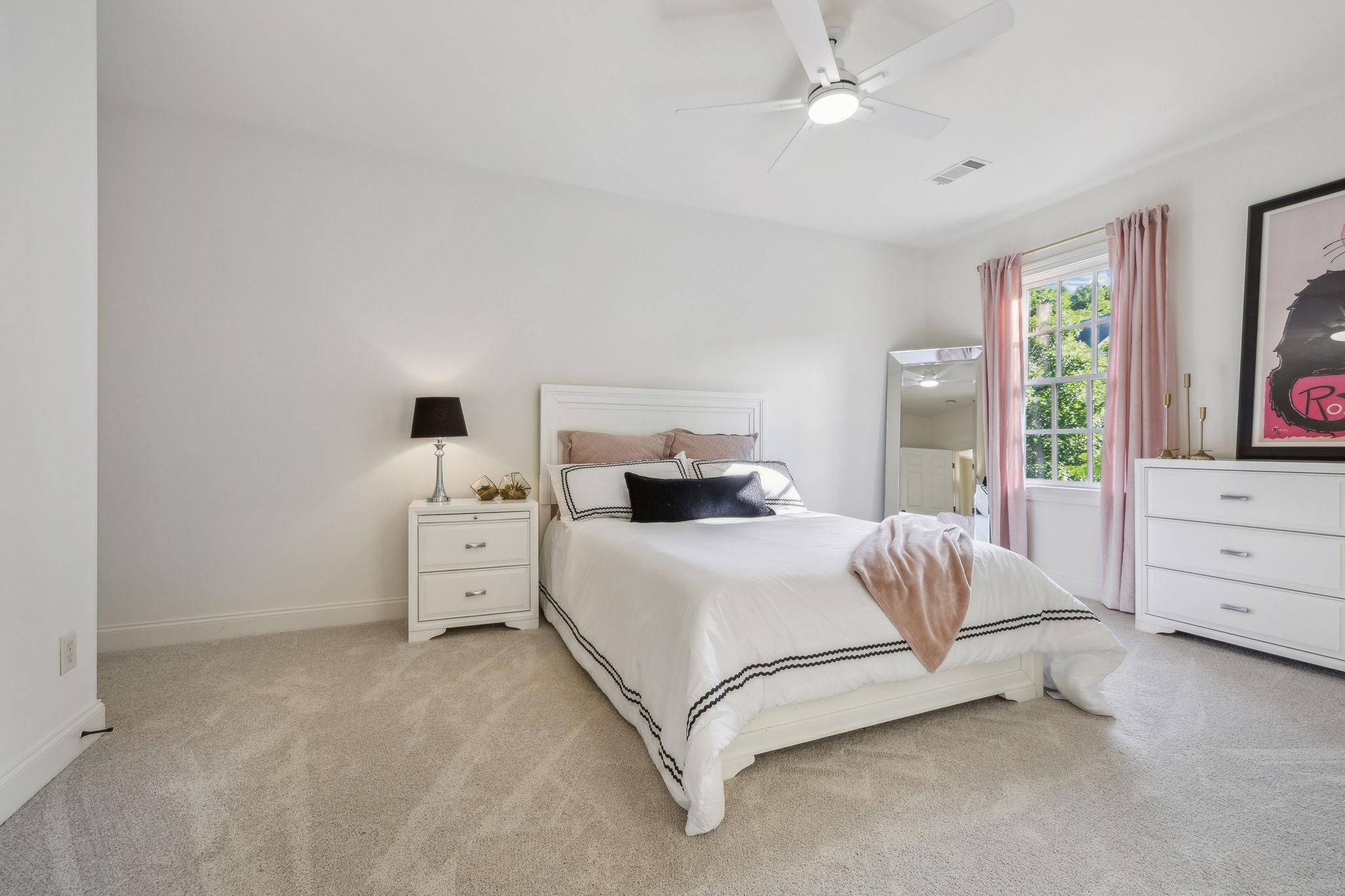 424 Wild Elm Street Franklin, TN 37064 - Photo 37 of 100 a room with a bed and a flat tv screen on dresser