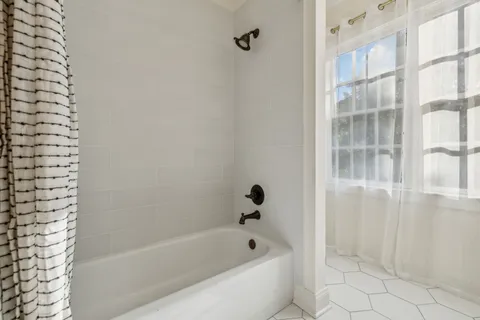 a bathroom with double sink and a mirror