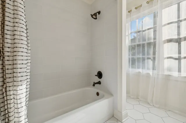 a bathroom with double sink and a mirror