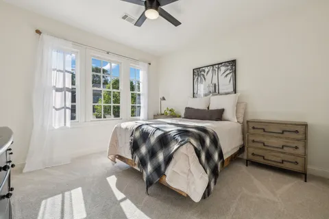 a view of a house with backyard porch and sitting area