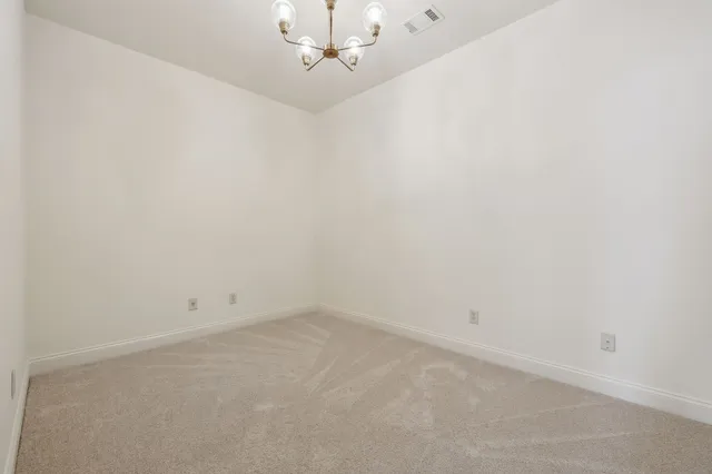 a view of a house with backyard water fountain and sitting area