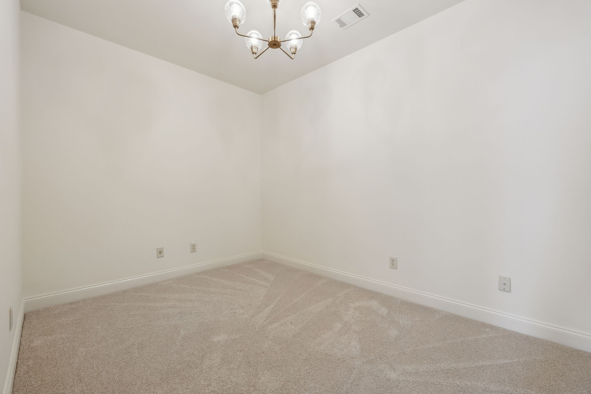 424 Wild Elm Street Franklin, TN 37064 - Photo 42 of 100 an empty room with a chandelier fan